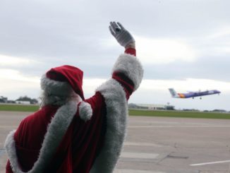 Santa waves passengers off at Cardiff Airport (Image: Cardiff Airport)