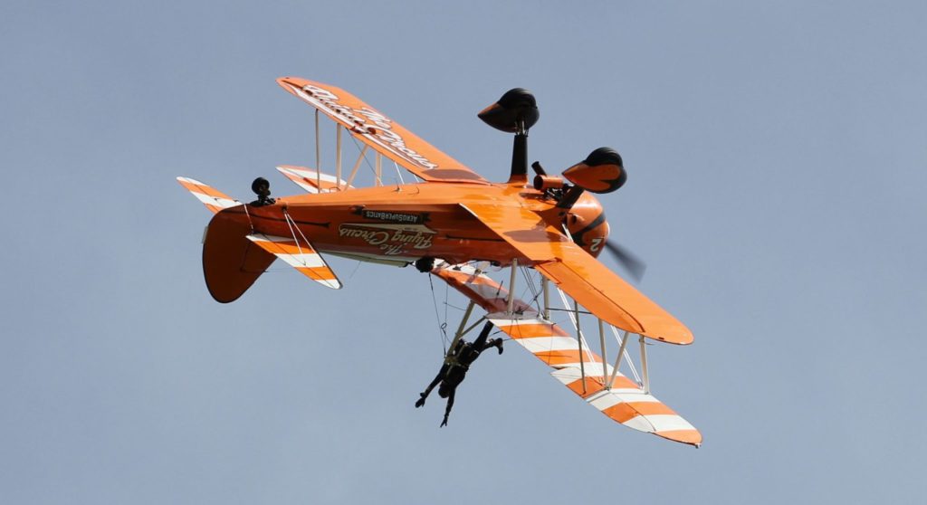 Seeing the world upside down is all in a days work for a wingwalker. (Image : UK Aviation Media)