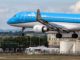 A KLM Embraer lands at Cardiff Airport (Image: TransportMedia UK)