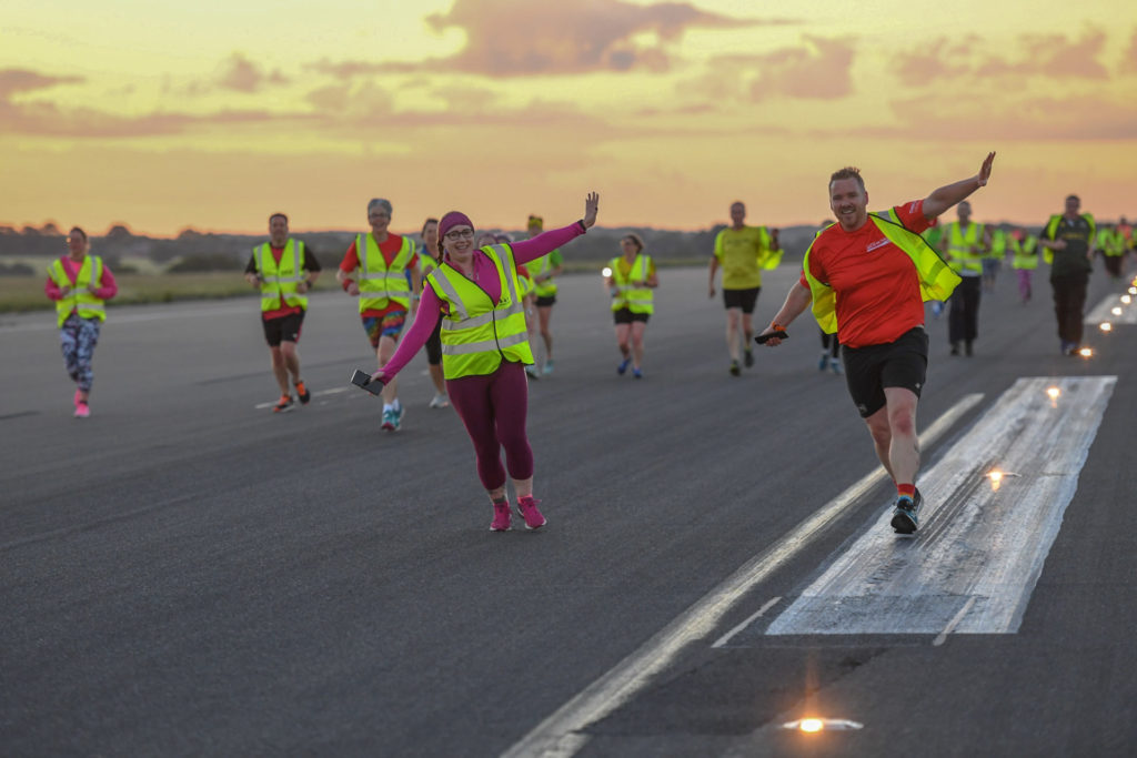 Hundreds run on Luton Airport's runway for Macmillan Cancer Support