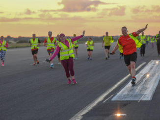 Hundreds run on Luton Airport's runway for Macmillan Cancer Support