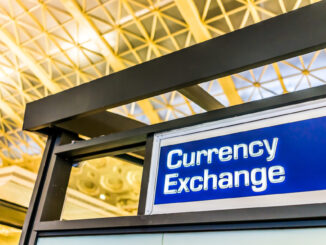 Closeup of currency exchange sign inside building