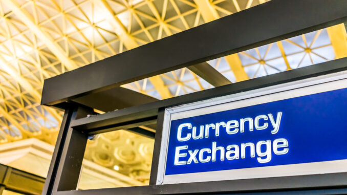Closeup of currency exchange sign inside building