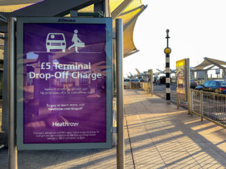 Warning sign informing drivers of a charge to drop off passengers at Terminal 5 at Heathrow Airport, now £6