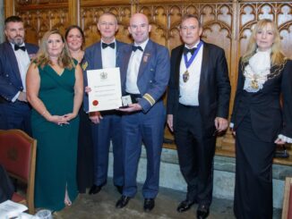OC BBMF, Sqn Ldr Mark ‘Suggs’ Sugden, holds the certificate for the Award of Honour. Left to right: Chief Technician Stu Read, Chief of Staff Flt Lt Emma Phillips, Admin Officer Diane Law-Crookes, Chief Technician Jeff Gullliver, OC BBMF, Capt Jonathan Legat, Master of the Honourable Company of Air Pilots, and Dame Susan Langley DBE, Representative Lord Mayor, City of London.