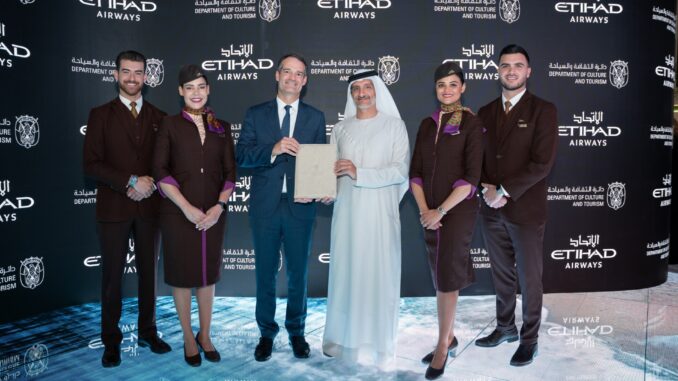 H.E. Saleh Mohamed Al Geziry (centre, right) and Antonoaldo Neves (centre, left) posing with the signed Stopover Abu Dhabi agreement.