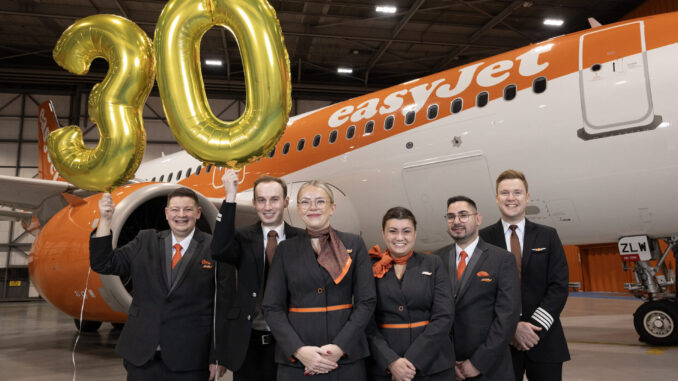 easyJet Cabin Crew L-R - Benjamin Collict, Oliver Spreadbury, Natalie Tavener, Danielle Robinson, Dimo Kolev, Jamie Smart at the easyJet 30th birthday celebrations at London Luton Airport