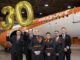 easyJet Cabin Crew L-R - Benjamin Collict, Oliver Spreadbury, Natalie Tavener, Danielle Robinson, Dimo Kolev, Jamie Smart at the easyJet 30th birthday celebrations at London Luton Airport